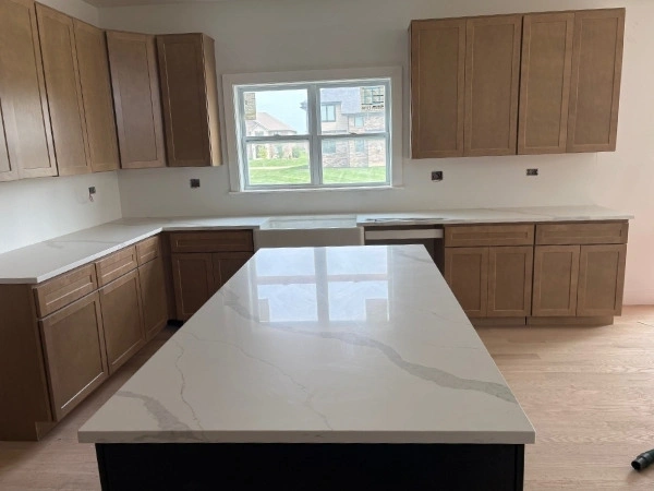 Kitchen with quartz countertops and a large center island